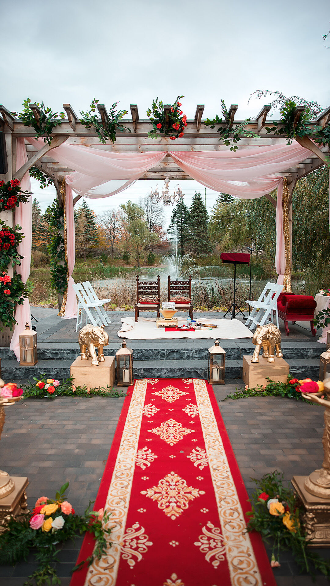 Scenic Indian wedding venue set against a lush green natural background